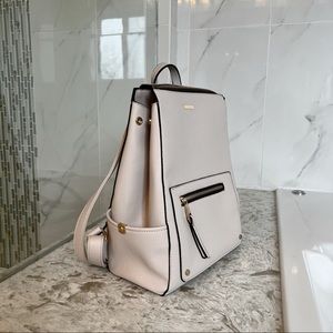 Faux Leather Cream Colored Backpack. Has many compartments. size is Medium. NEW